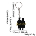 Acrylic graduation keychain with male and female student silhouettes and gold lettering - Graduates Silhouette Style