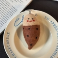 Handmade wool felt acorn keychain charm in brown and beige with a cute smiling face - Sweet Potato