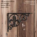 Retro black cast iron shelf bracket with fleur-de-lis pattern and mounting screws - Fleur-de-Lis Pointed Support Bracket 2593