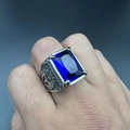 Detailed relief of eagle totem on vintage silver ring with rectangular blue gemstone - Dark Blue