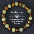 8mm Tiger Eye and Green Jade beaded protection bracelet on a black textured background - Tiger Eye and Southern Jade (Protection-1)