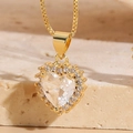 Macro shot of 14K gold plated heart pendant with large zircon and micro-pave setting - White Zirconia