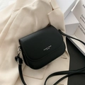Minimalist black saddle crossbody bag featuring Fashion Trend lettering on matte leather - Black