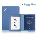 Haze blue PU leather passport holder featuring a golden airplane logo and clear ID window - Haze Blue