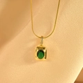 Detail of luxury emerald necklace pendant with white zircon on champagne silk background - Emerald Zirconia Style / 40+5cm