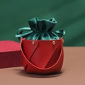 Detail of red leather base and green velvet drawstring pouch for Christmas gift packaging - Red Bucket + Green Velvet (Sample)