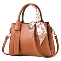 Brown leather handbag with crocodile pattern details and a decorative smile silk scarf - Earthy Yellow