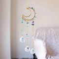 Detailed view of handmade golden moon suncatcher with colorful crystals and faceted prisms - Colorful Fluorite