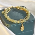 Double-layered bracelet with green jade beads and golden leaf pendant on a velvet box - S056-golden Branches And Jade Leaves Bracelet #sz453