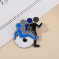 Macro detail of abstract silhouette enamel pin featuring blue and grey layered human figures - Blue Shadow