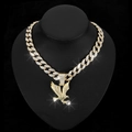 Detail of gold Cuban link chain with iced out eagle pendant and large crystal - Gold with 18-inch Cuban Chain