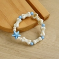 Ceramic beaded bracelet with white bone beads and a blue starfish pendant design - Starfish Blue Bone Style (1645-08) / Blue & White