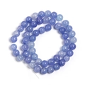 Macro shot of blue cracked glass beads in spiral layout for jewelry making and DIY crafts - Royal Blue Floral Round Bead