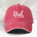 Detailed close-up of a washed red baseball cap featuring the white Nah I'M GOOD embroidery - Red