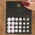 Set of 12 pairs of sparkling cubic zirconia stud earrings with golden finish settings - 12 Pairs Gold Round Zirconia Set (E1786-1)