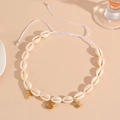 Detail of shell necklace with golden dolphin, fish, and turtle charms on white cord - White Rope Fish Necklace