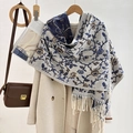 Close-up of beige jacquard shawl with blue vintage floral patterns and fringe details - Blue