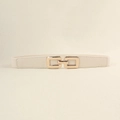 Dettaglio della fibbia dorata a incastro e del tessuto elastico color crema della cintura - Beige / 60CM