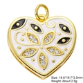 Macro detail of gold-plated heart pendant with white enamel and cubic zirconia inlay - White Base Black Eye Heart