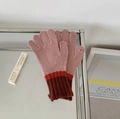 Pink and red knitted wool blend gloves featuring ribbed cuffs on a glass surface - Contrast-Pink