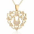 Macro shot of gold-plated heart pendant with MOM letters and shimmering inlaid crystals - Small Diamond Heart Combination MOM Style (21798)