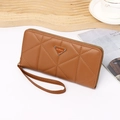 Detail of brown quilted leather long wallet with zipper and detachable wristlet strap - Brown