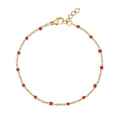 Detail of a gold chain bracelet featuring vibrant red beads and a lobster clasp closure - Bracelet / Red