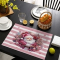 Pink striped Christmas placemat featuring Santa Claus and roses on a dark wood table - CD57-13