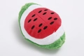 Squeaky plush dog toy in a watermelon slice design with vibrant red and green faux fur - Oval Watermelon