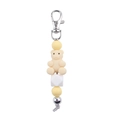 Detail of yellow silicone bear keychain with silver metal clip and geometric beads - Beige