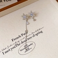 Detail of 18k gold plated snowflake earrings with zircons and tassels on fabric - 35# Silver Pin - Silver