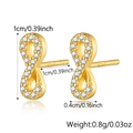Macro detail of gold infinity stud earrings with S925 hallmark and 1cm size marker - Infinity