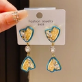 Macro detail of S925 silver earrings with blue crystal heart and teardrop pearl - Style 33# Silver Pin-Gold-Blue-Heart
