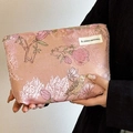 Pink vintage brocade makeup bag featuring elegant magnolia and bird embroidery patterns - Magpie Pink
