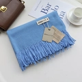 Sky blue cashmere-feel winter scarf with tassel trim on a cozy lifestyle background - Oxygen Blue / 200cm