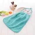 Detail of light blue coral fleece hand towel with pink floral trim and hanging loop - Small / Green