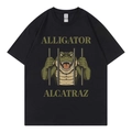Women's black crewneck T-shirt with Alligator Alcatraz graphic print in a flat lay view - S / Black