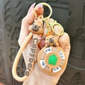Cute brown cartoon capybara silicone keychain with a rotating decision wheel charm - Turtle Roulette