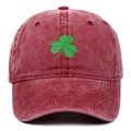 Close-up of green shamrock embroidery on a burgundy washed cotton baseball cap - Adjustable / Burgundy