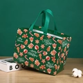Dark green non-woven Christmas gift bag with festive gingerbread and star patterns - Green Christmas Gift