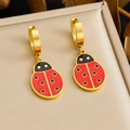 Detailed macro view of gold-plated ladybug earrings in a beige leather jewelry gift box - Ladybug Hoop Earrings (E6251)