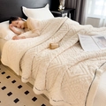 Thick cream flannel fleece blanket with geometric diamond texture and black contrast piping - Milk White