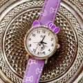 Detail view of purple leather strap watch with cute cartoon cat dial for girls - Purple