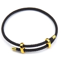 Adjustable black braided rope bracelet with three polished gold metal accents on white background - 2mm / Black-1