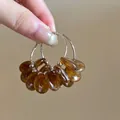 Macro detail of retro rattan-style hoop earrings featuring amber resin beads and silver pin - 6# 925 Sterling Silver Earring Post - Coffee - Amber Resin Hoop