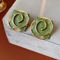 Close-up of vintage green square earrings with golden spiral metal design on velvet - 925 Silver Needle / Green