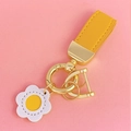Cute yellow leather keychain with golden rings and a white flower charm on pink background - Yellow Leather [White Flower]