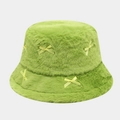 Close-up of green plush faux fur bucket hat with delicate yellow satin bows decoration - One Size / Green