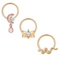 Detail of rose gold nose rings set featuring moon, butterfly, and snake charms - 1.2x8mm / Rose Gold Snake Butterfly Moon Style (Set of 6)