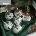 Palline di Natale in acrilico da 6cm con motivi bianchi di case e alberi invernali - Casa floccata trasparente
